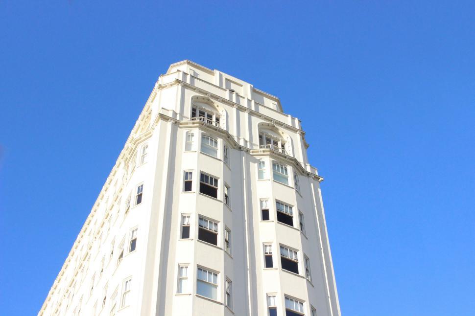 Free Image of Tall White Building With Clock 