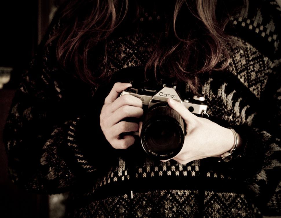 Free Image of Woman Holding Camera 