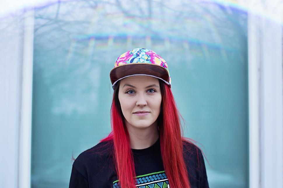 Free Image of Woman With Long Red Hair Wearing a Hat 