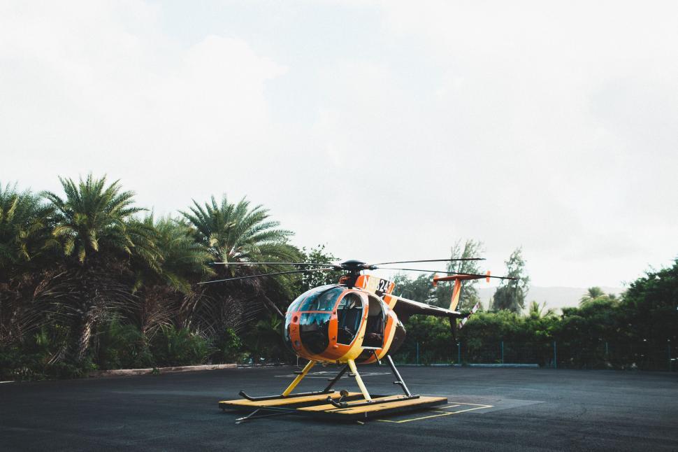 Free Image of Helicopter Parked on Top of Parking Lot 