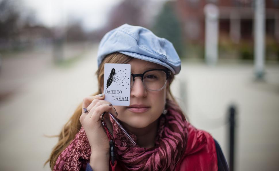 Free Image of Woman With Glasses and Hat Talking on Cell Phone 