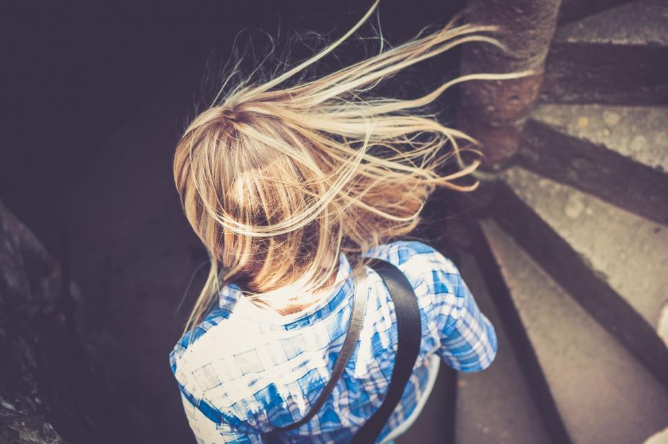 Free Image of Young Girl Walking Up Stairs 