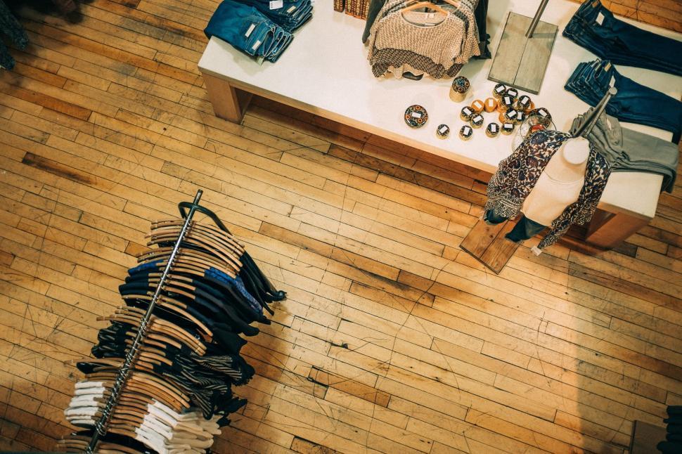 Free Image of Overhead View of Clothing Store With Clothes on Display 