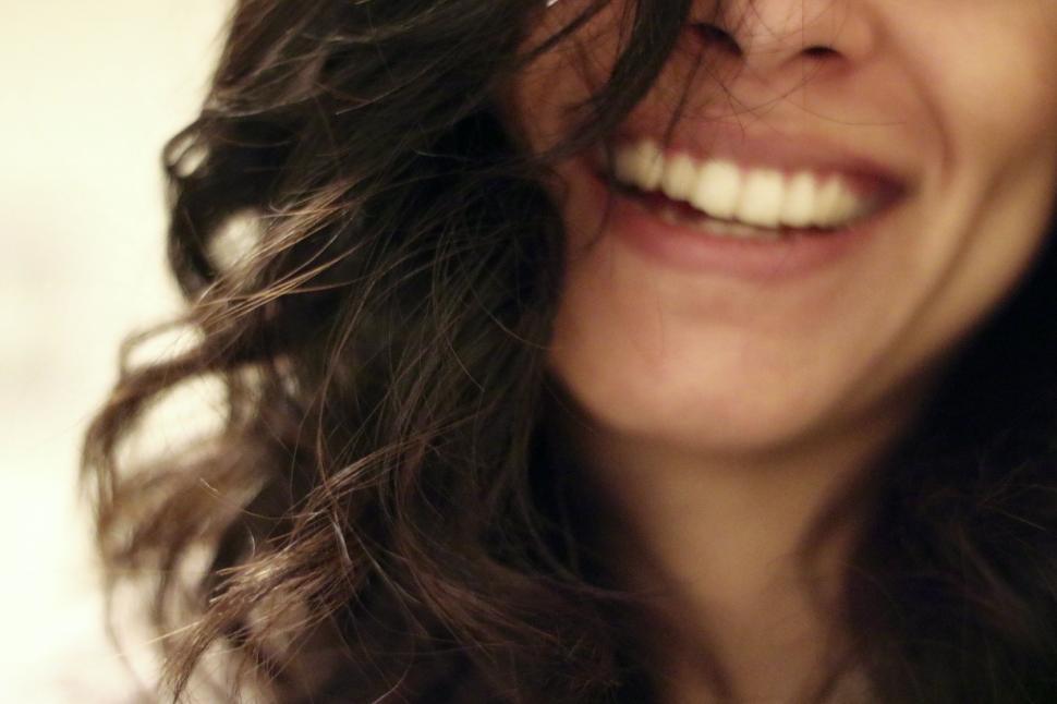 Free Image of Close Up Portrait of Smiling Woman With Long Hair 