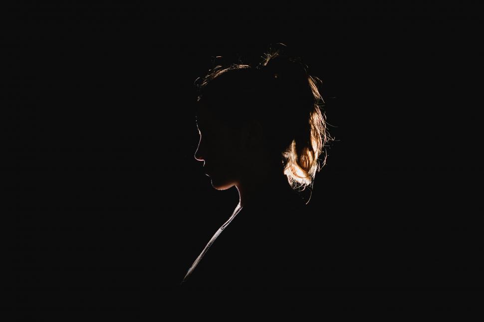 Free Image of Woman Silhouette in Darkness 