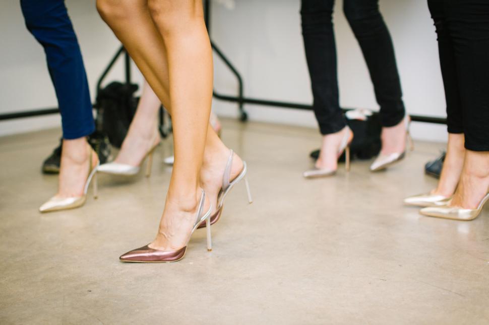 Free Image of Group of Women Standing in High Heels 