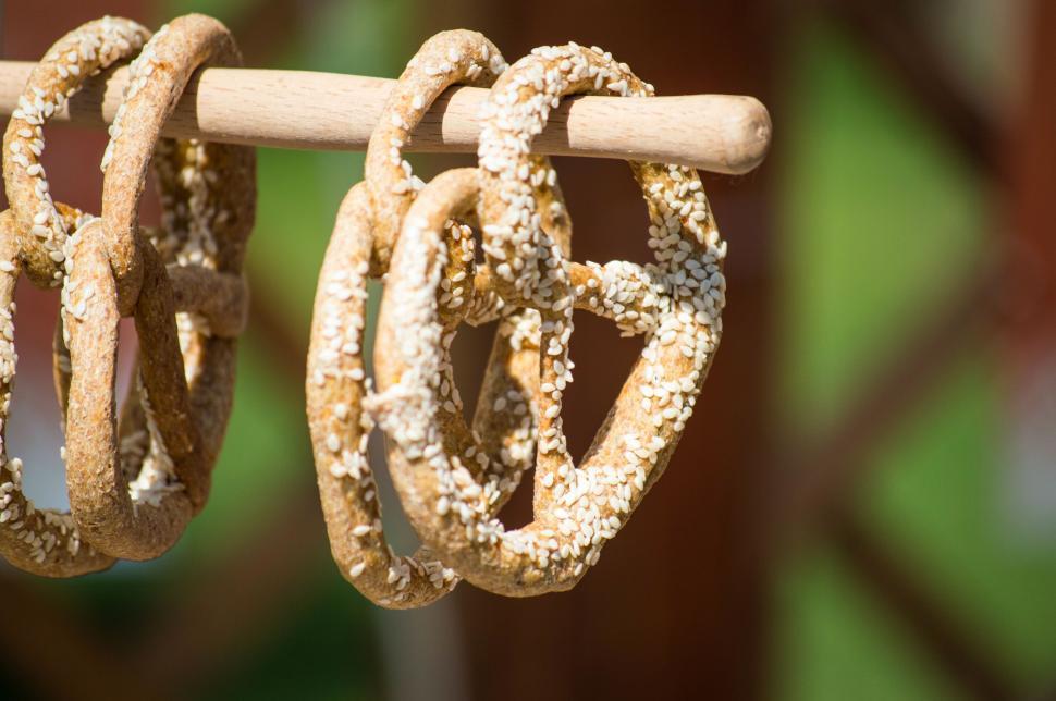 Free Image of Pair of Pretzels Hanging From Clothes Line 