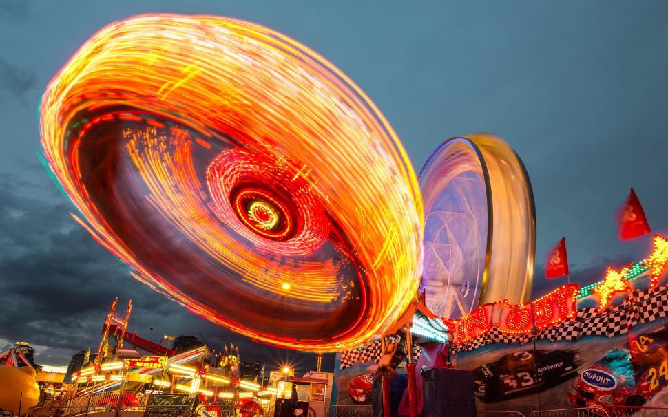 Free Image of Vivid Light Show on Carnival Ride 
