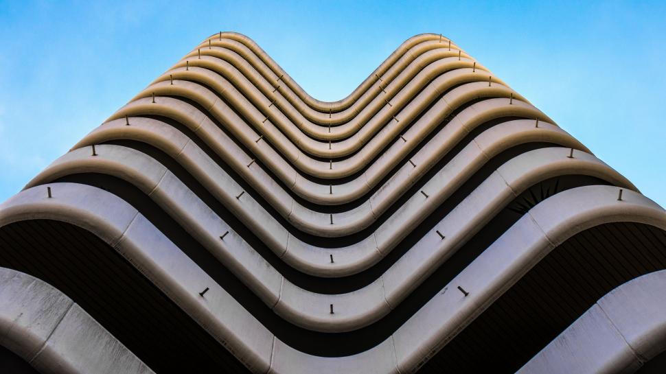 Free Image of Towering Building With Wavy Lines 