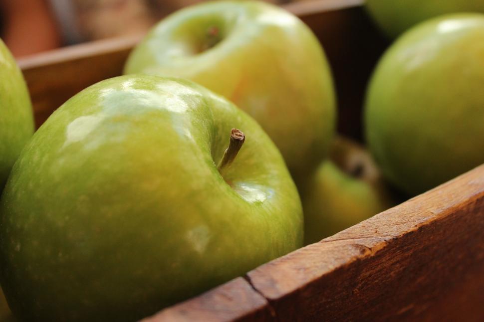 Free Image of Wooden Box Filled With Green Apples on Table 