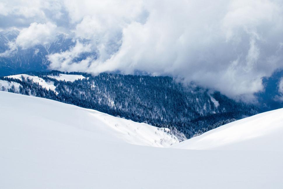 Free Image of Man Skiing Down Snow Covered Slope 