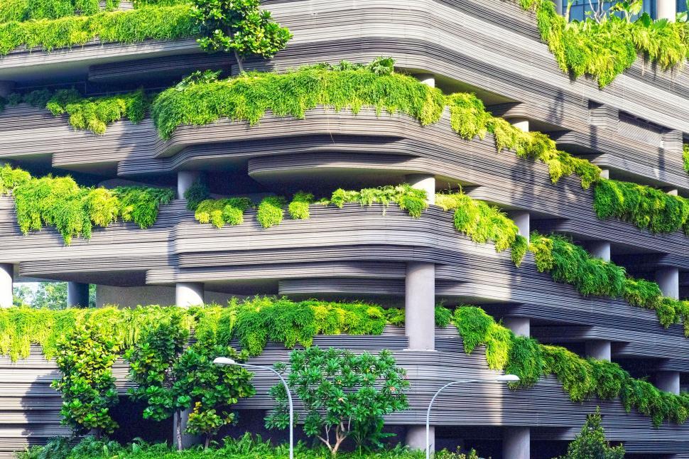 Free Image of Towering Building Covered in Lush Plants 