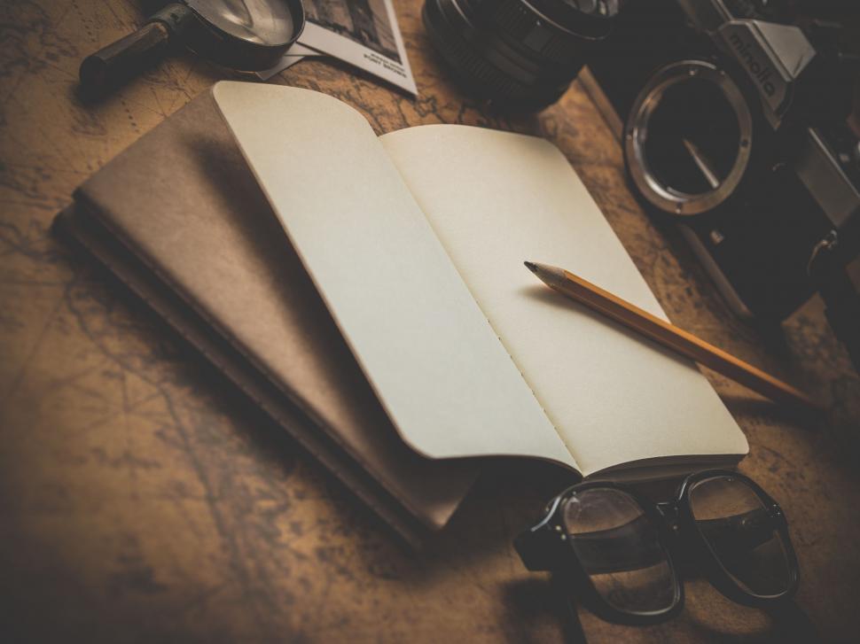 Free Image of Open Notebook and Glasses on Table 