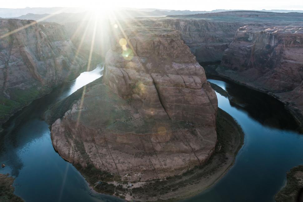 Free Image of The Sun Shines Over a Vast Canyon 