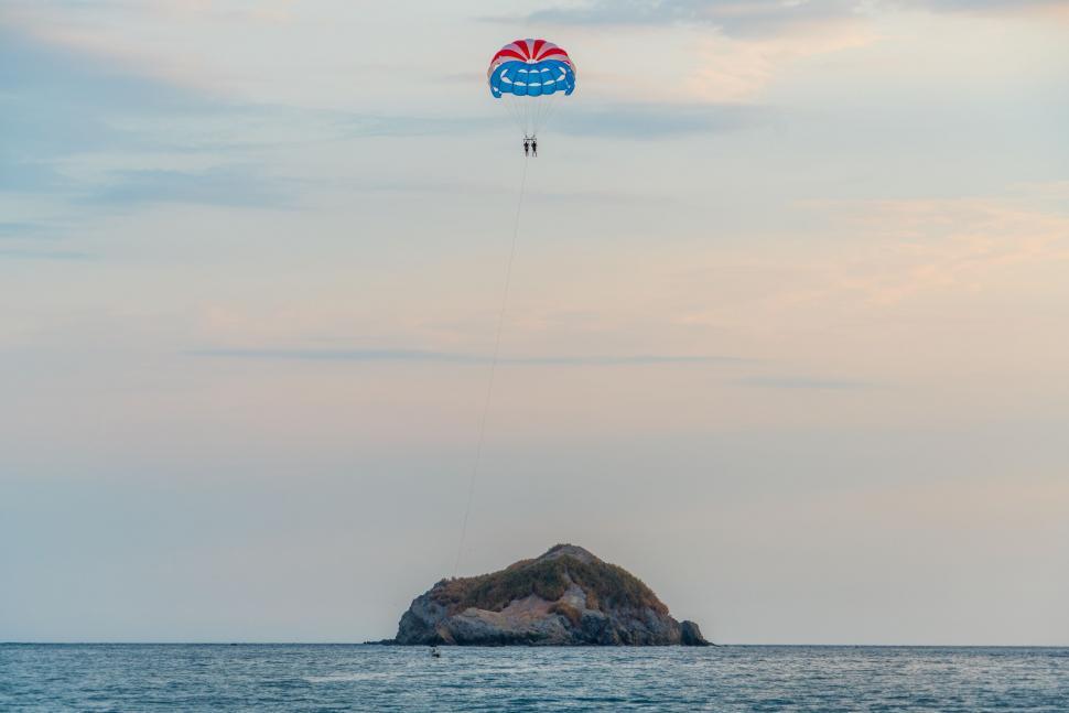Free Image of Kite Flying Above Vast Water 
