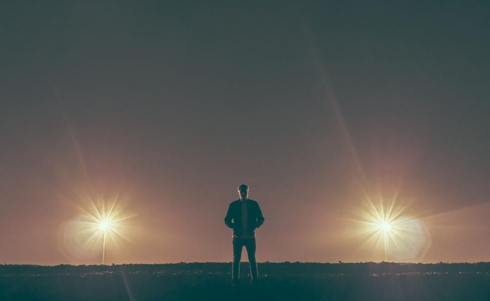 Free Image of Man Standing in Field at Night 