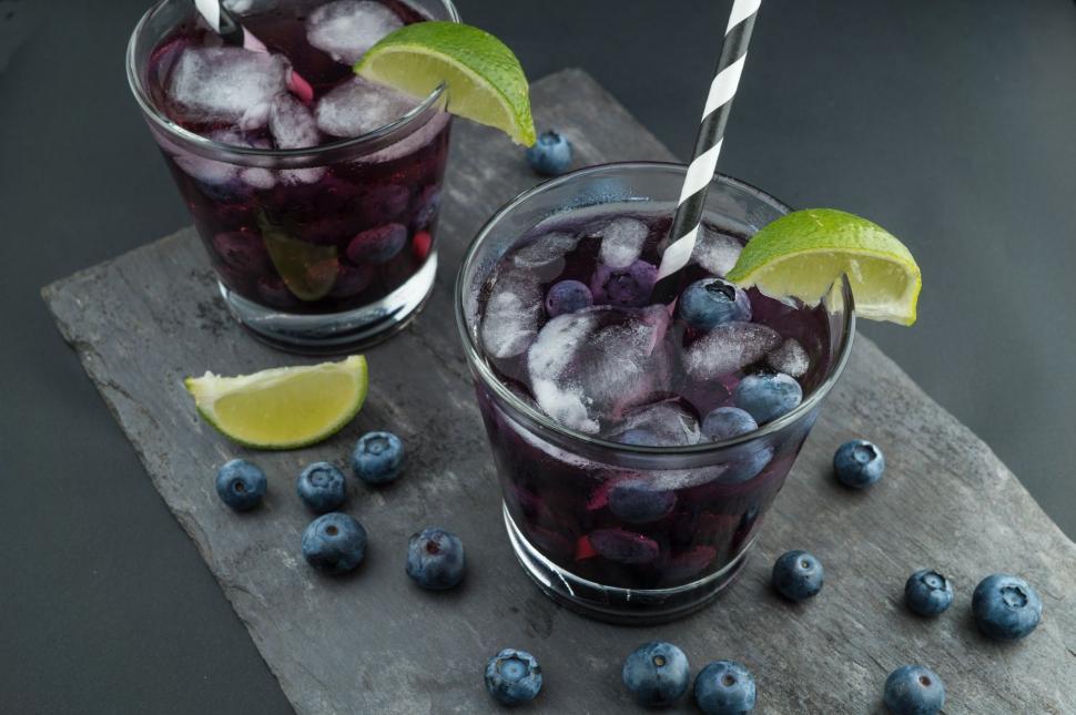 Free Image of Two Glasses Filled With Blueberries and Limes 