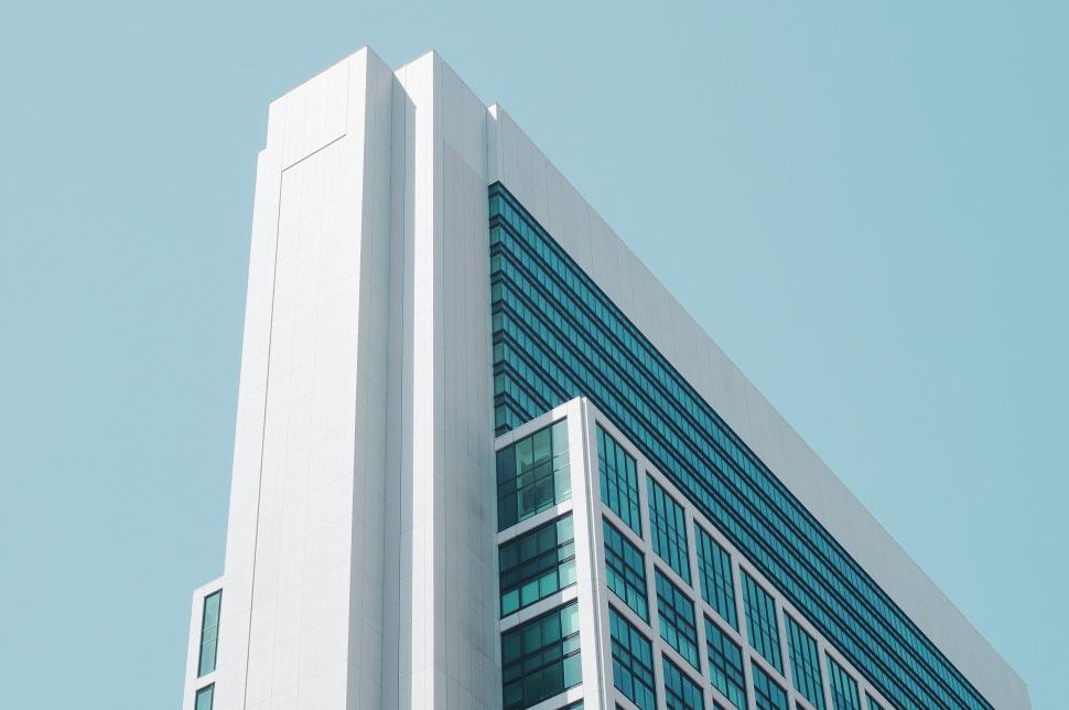 Free Image of Tall White Building Against Sky Background 