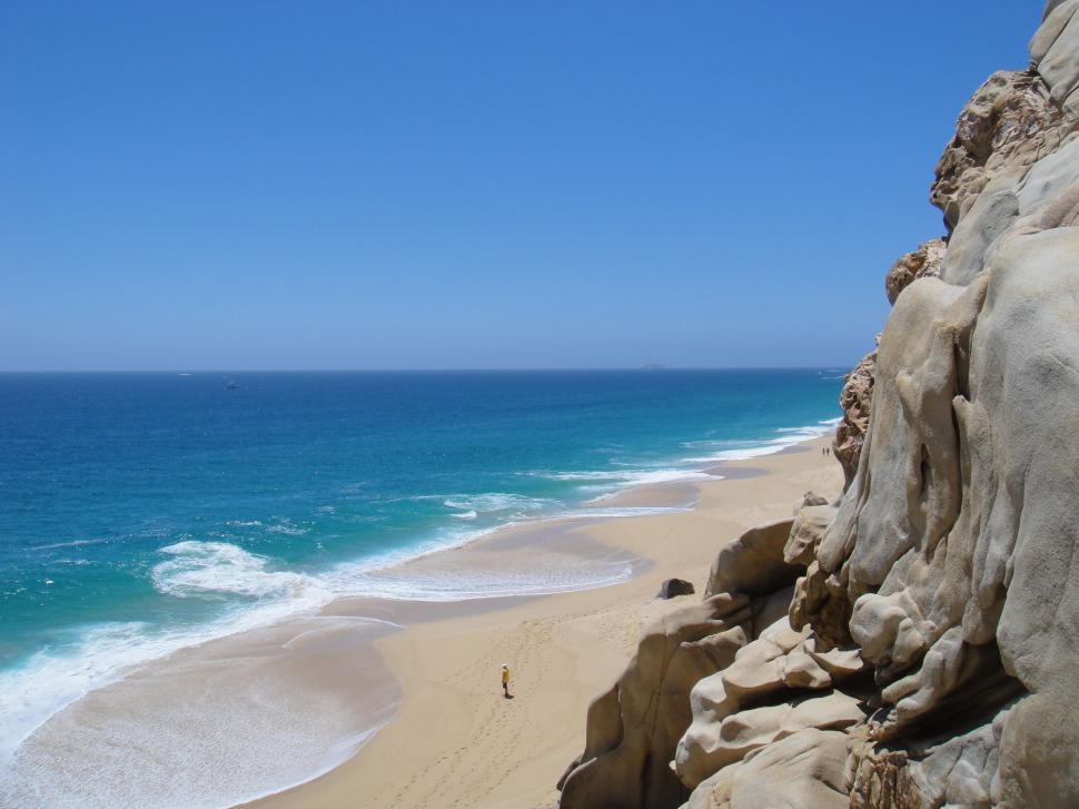 Free Image of A View of a Beach From a Cliff 