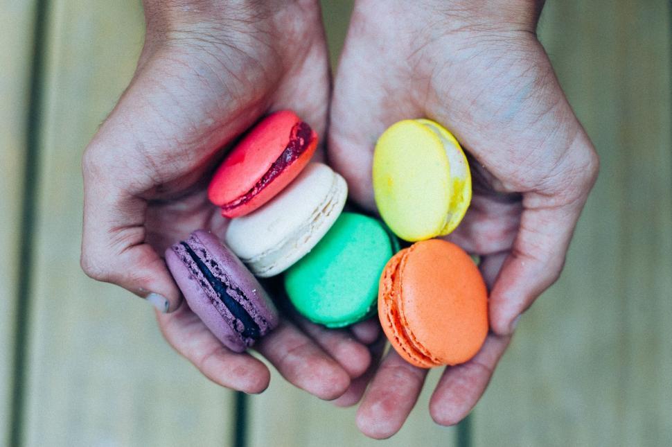 Free Image of Person Holding Five Different Colored Macaroons 