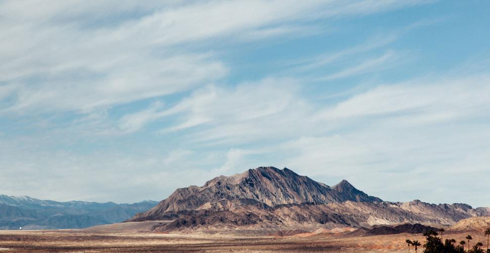 Free Image of Desert Landscape With Mountain in Background 