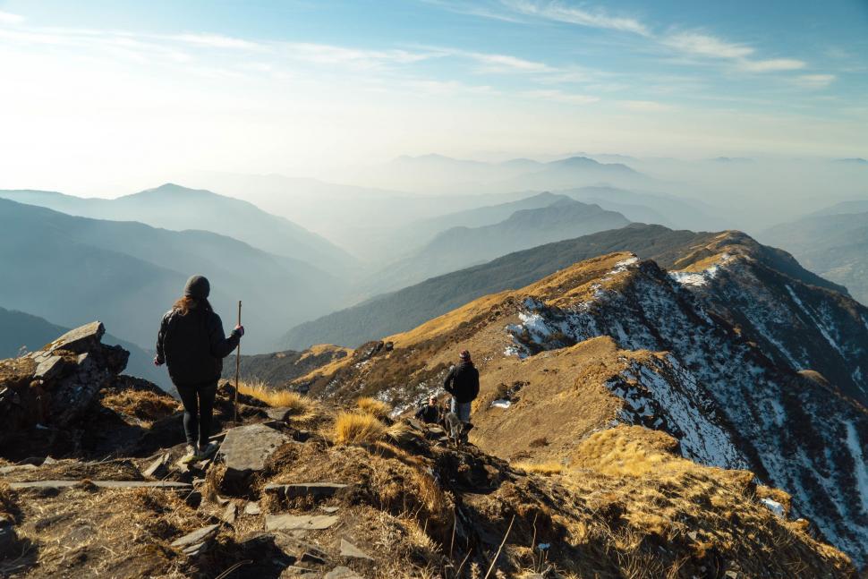 Free Image of Couple Standing on Mountain Top 