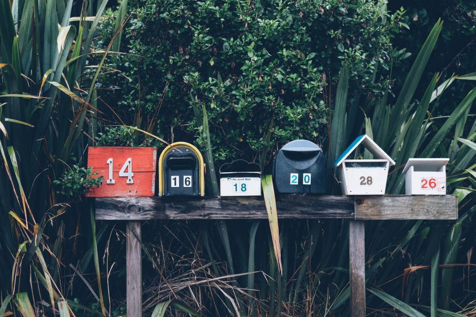 Free Image of Row of Mail Boxes on Wooden Table 