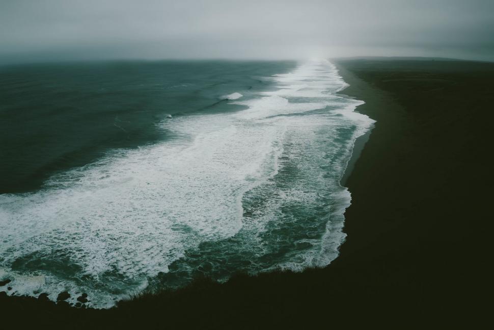 Free Image of Waves Crashing on Rocky Shoreline 