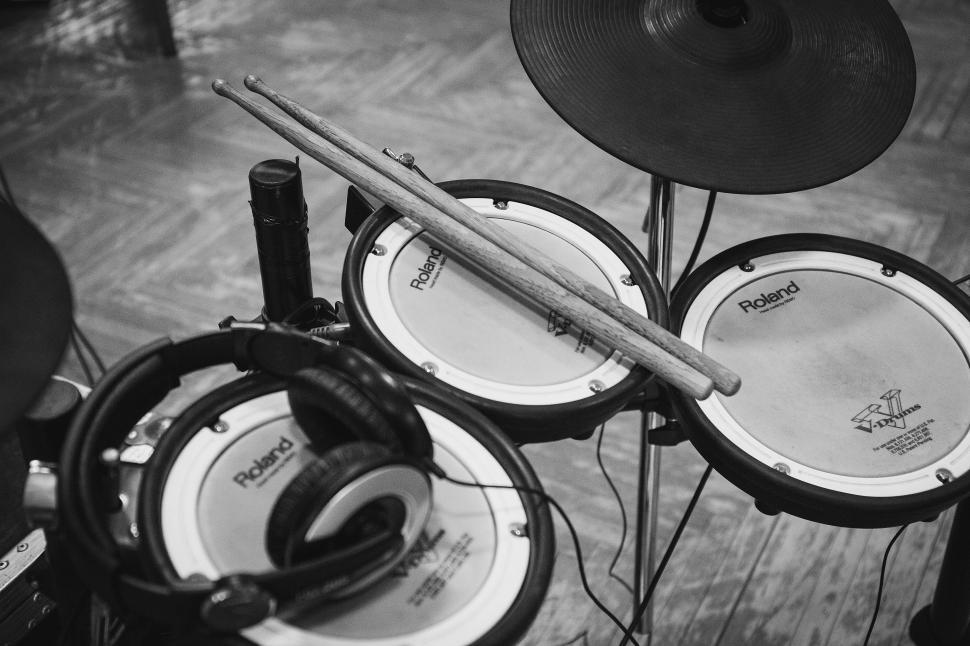 Free Image of Drums and Headphones on Wooden Floor 