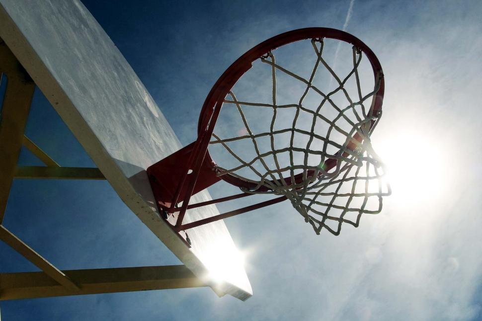 Free Image of basketball hoops net sun flare sports backboard basket rim silhouette 