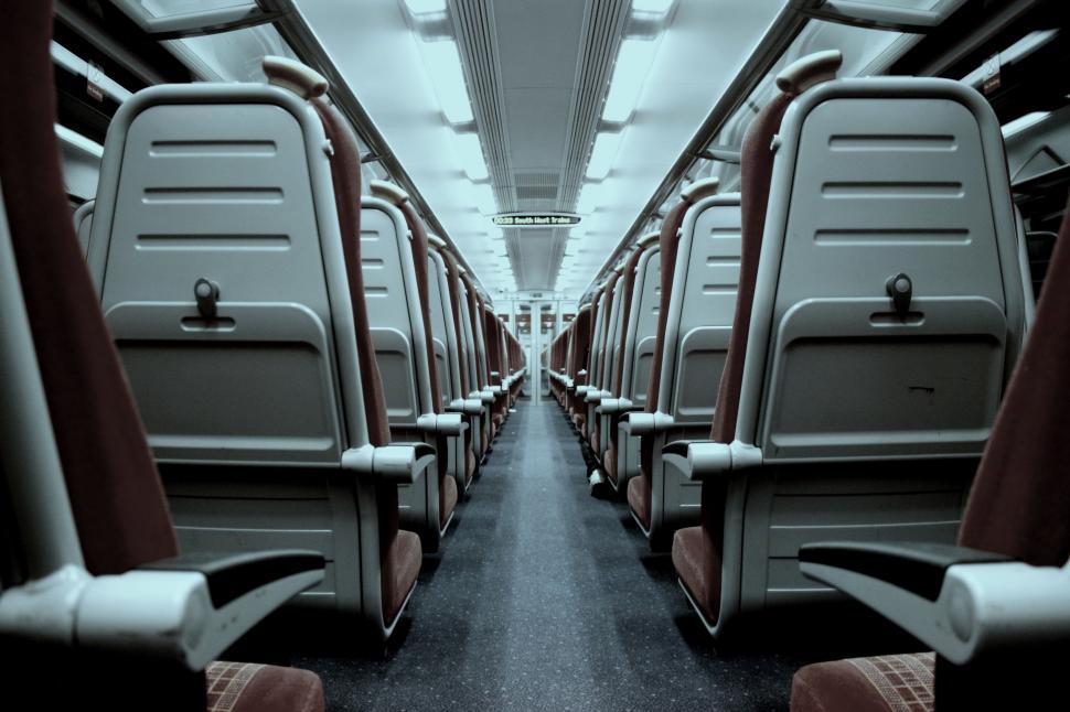 Free Image of Empty Train Car With Red and Gray Seats 