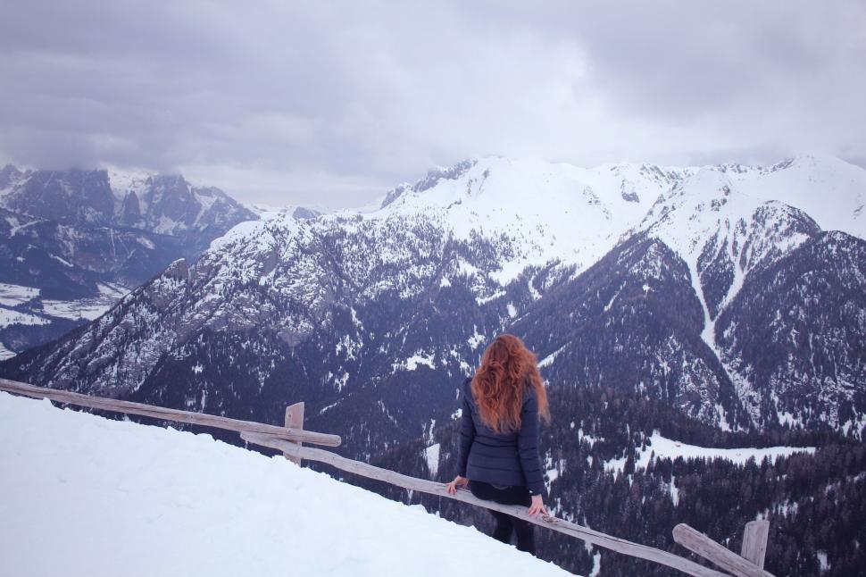 Free Image of Woman Standing on Snow Covered Slope 