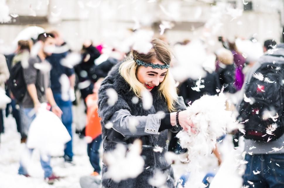 Free Image of Woman Throwing Snow in the Air 