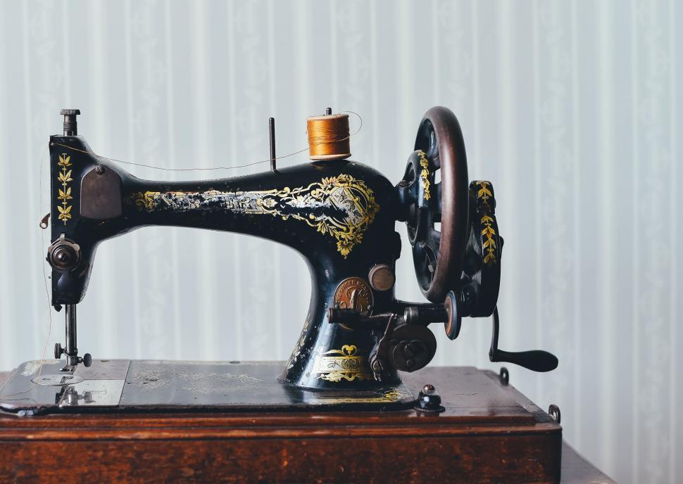 Free Image of Antique Sewing Machine on Wooden Box 