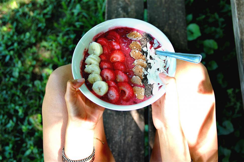 Free Image of Person Holding Bowl of Fruit and Cereal 