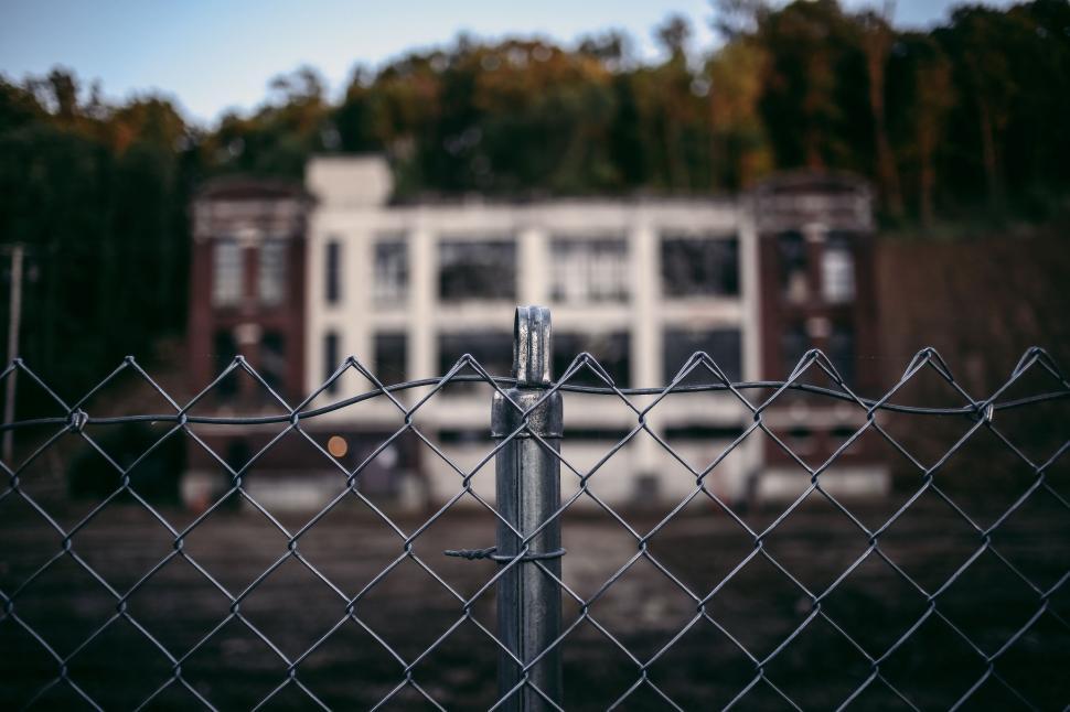 Free Image of Chain Link Fence With House in Background 