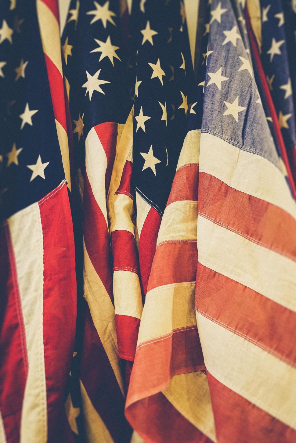 Free Image of American Flags Hanging From a Wall 