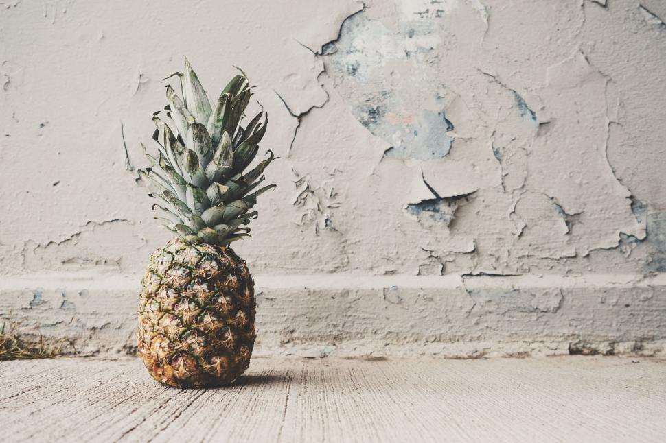 Free Image of Pineapple on Wooden Floor 