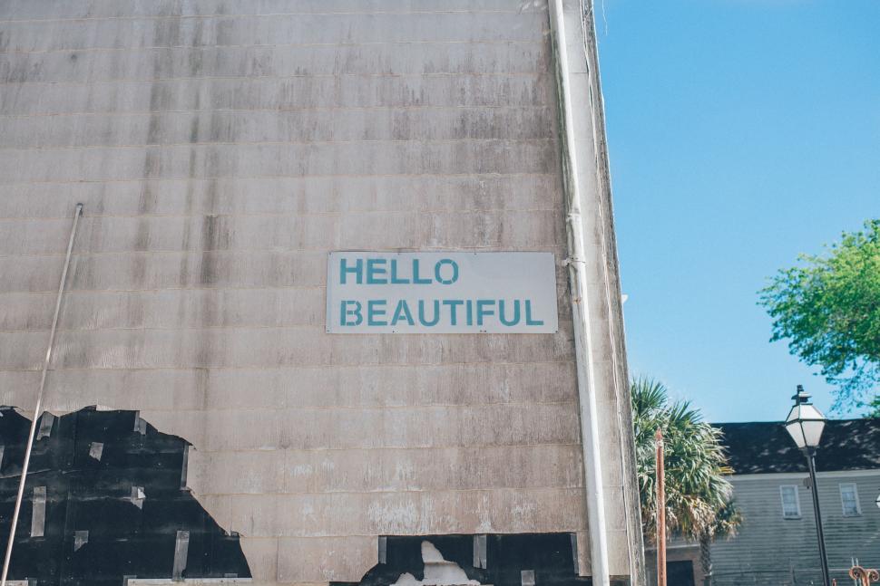 Free Image of Sign Saying Hello Beautiful on Building 