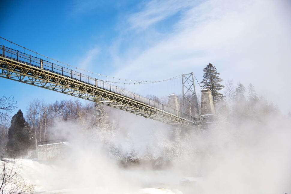 Free Image of Steam Rising From Bridge Over River 