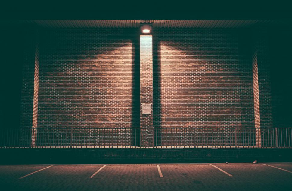 Free Image of Empty Parking Lot at Night With Light On 
