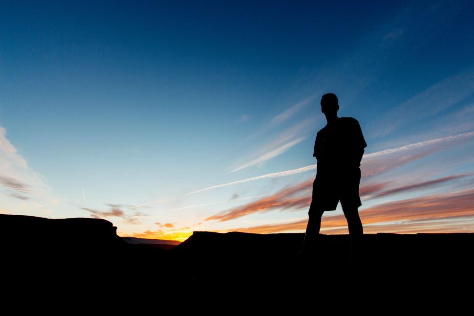 Free Image of Man Standing on Top of Hill 