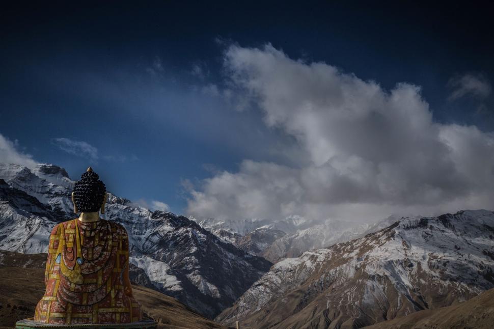 Free Image of Large Buddha Statue Sitting in the Middle of a Mountain 