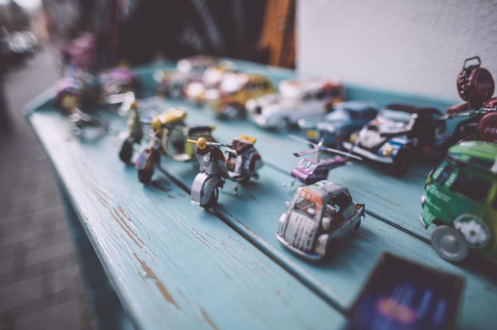 Free Image of A Blue Table Covered With Toy Cars 
