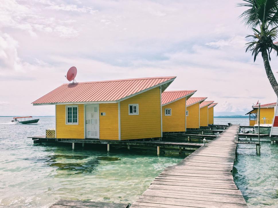 Free Image of Dock With Small Yellow Houses 