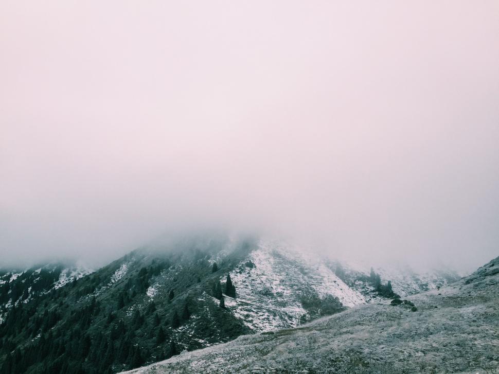 Free Image of Snow Covered Mountain With Clouds 