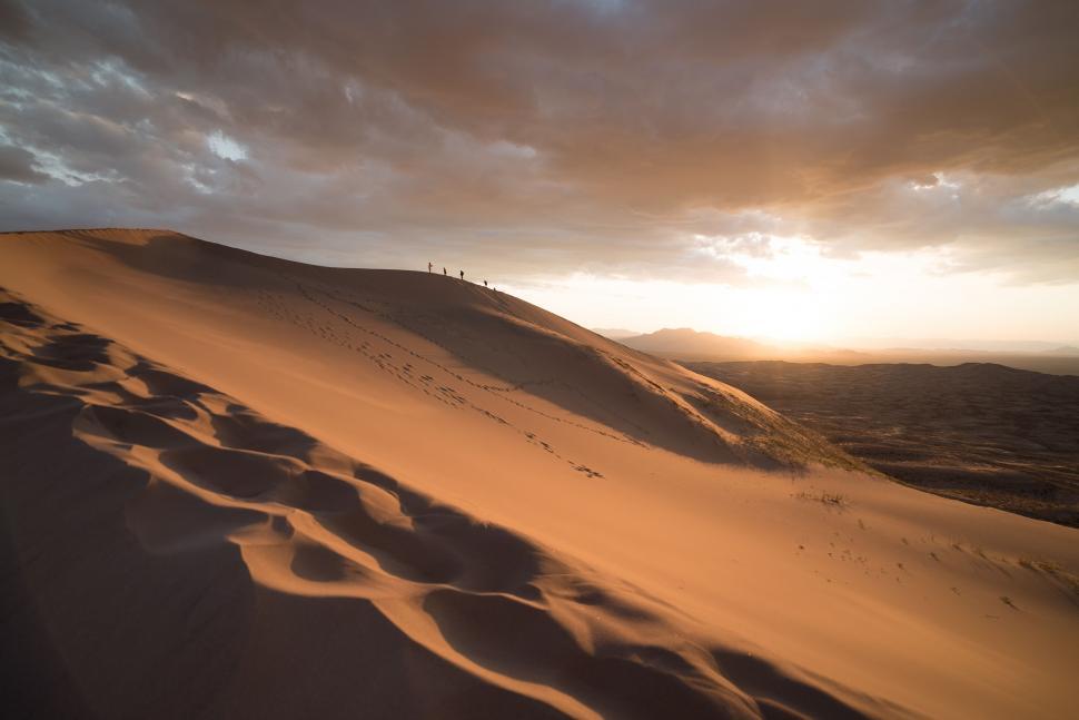 Free Image of Sun Setting Over Sand Dunes 