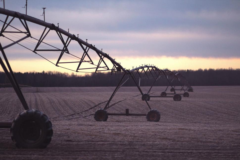 Free Image of Row of Farm Equipment in Field 