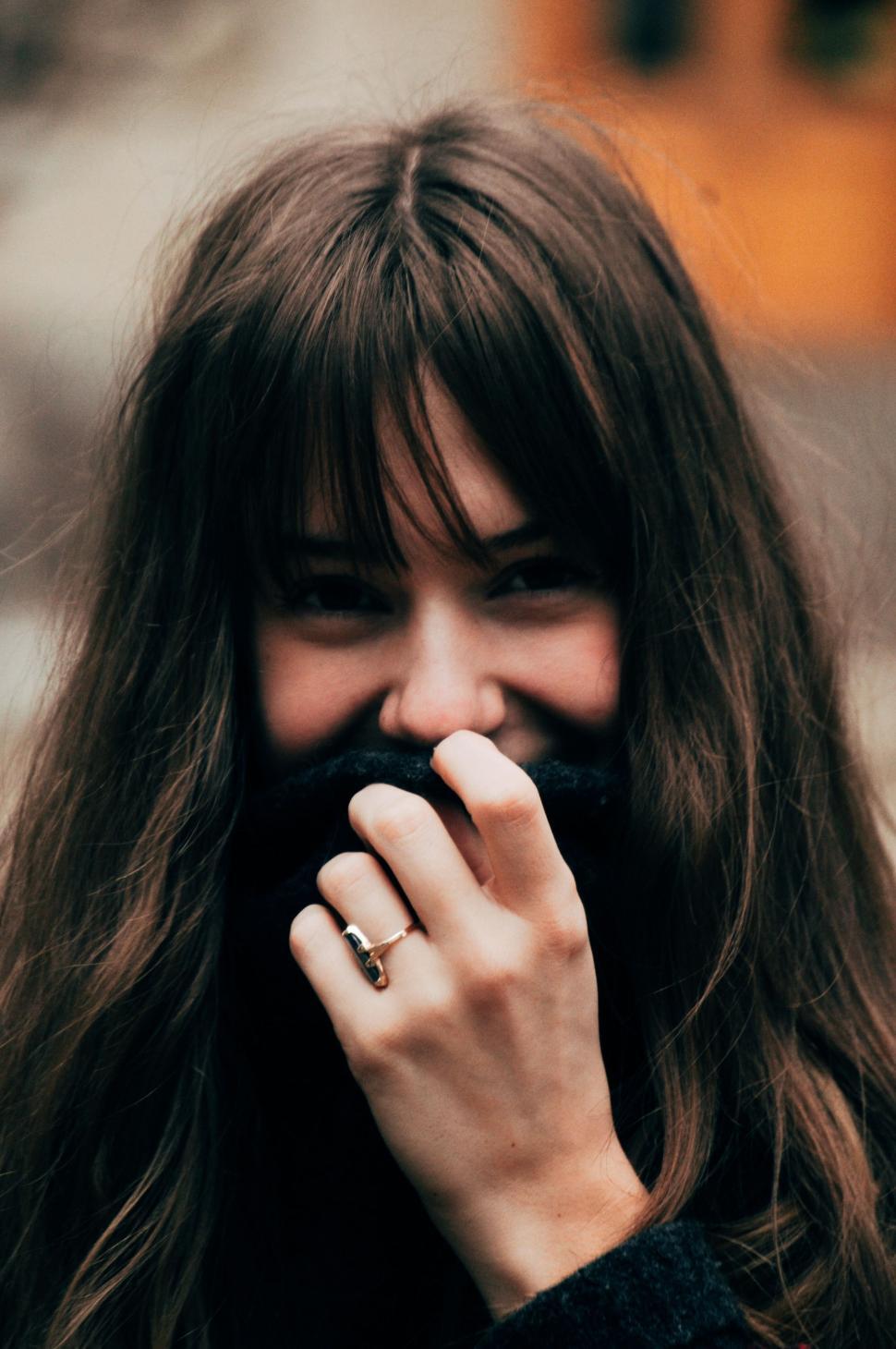 Free Image of Woman With Long Hair and Ring on Finger 