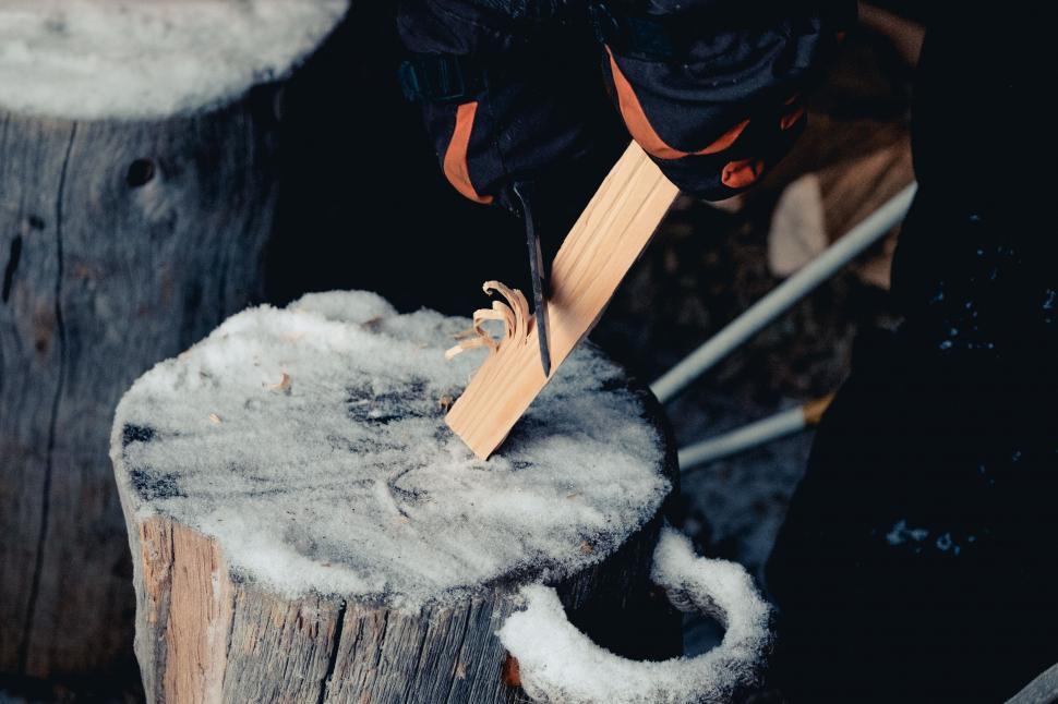 Free Image of Person Cutting Wood With Scissors 